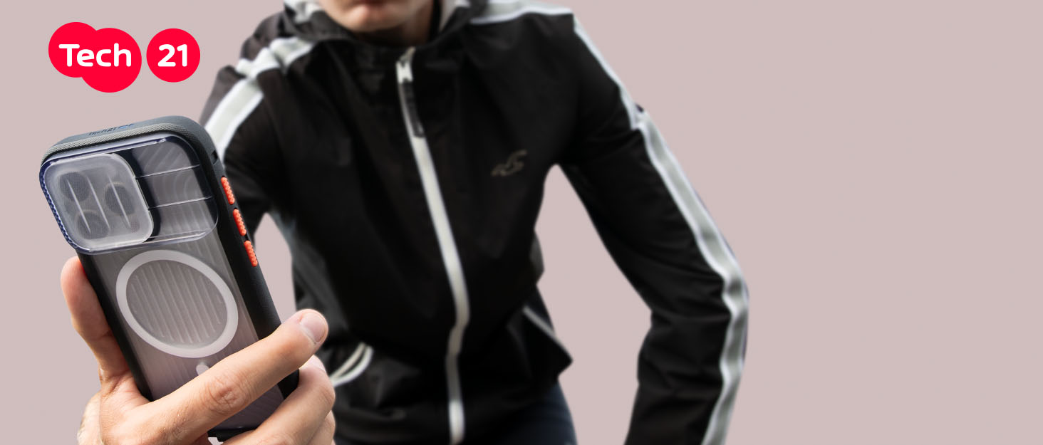 Person in sportswear holding phone in rugged case