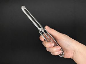 A close-up of the handle of a vegetable peeler