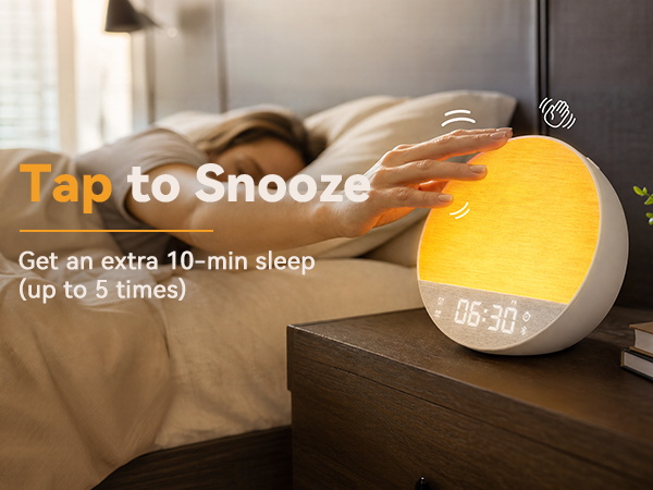 Tap to snooze alarm clock with white noise allowing extra sleep for heavy sleepers.
