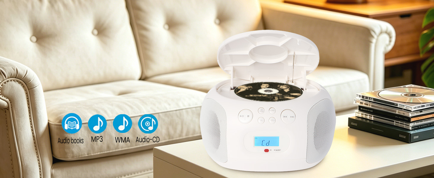 Top-loading CD player with disc inside, stack of CDs on table beside it.