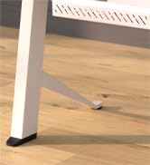 Close-up view of a white table or desk leg on a light wooden floor. The leg appears to be square or rectangular in shape.