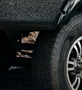 Camco leveling blocks, FasTen ramps, and Big Blocks sitting on the ground in front of an RV