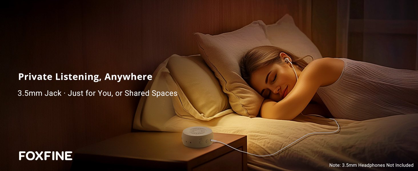 Woman resting in bed using headphones with FOXFINE sound machine nearby