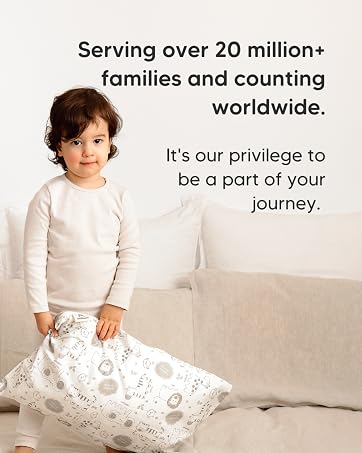 Toddler holding KeaBabies pillow in cozy room with message for families worldwide