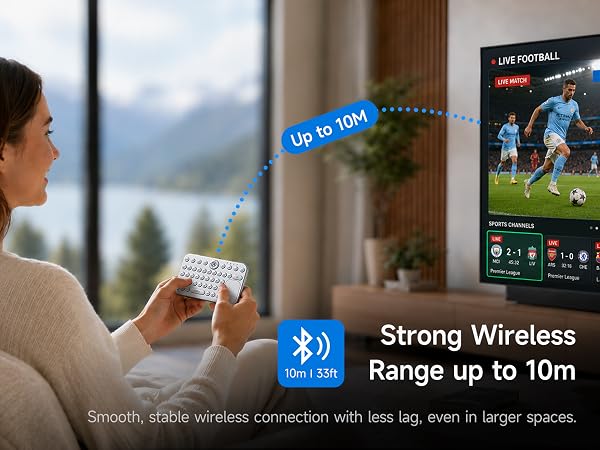 Woman using mini Bluetooth keyboard to control smart TV within 10 meters