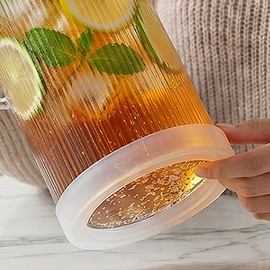 This glass cold water pitcher with a lid features a detachable silicone base.
