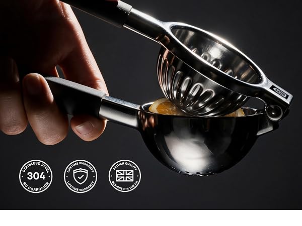 Hands pressing a lemon half with the 304 stainless steel lemon squeezer, designed in the UK