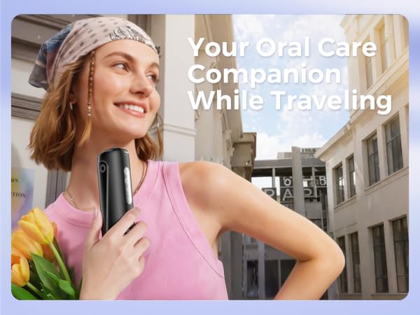 Text reads 'Your Oral Care Companion While Traveling'. Woman in pink top with headphones around neck, smiling outdoors with blurred architectural background.