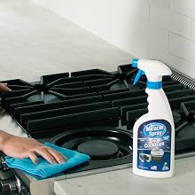 Hand cleaning cooktop with MiracleSpray for Cooktop & Microwave