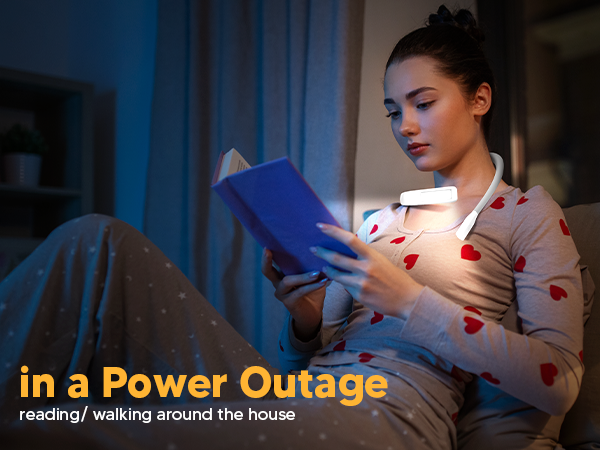 A young woman is studying bible during a power outage with EastPin reading light neck book light on