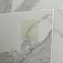 HairStixies installed on a shower wall