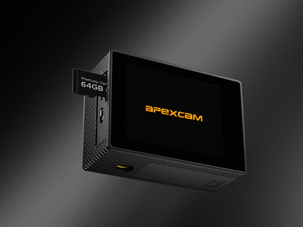 Black electronic device or media box photographed against dark background with illuminated display showing text.
