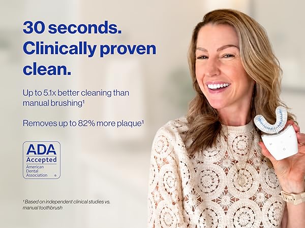 Woman holding Autobrush and smiling, ADA seal on the right