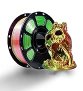 3D printing filament spool showing multiple colors including pink and green, displayed next to a golden figurine print sample.