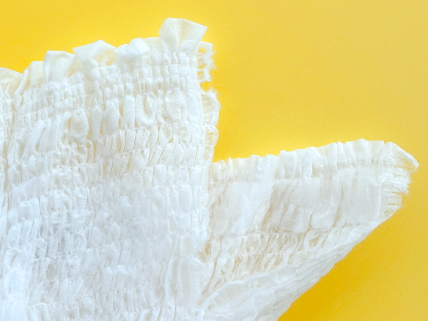 Remove using tear away side seams and dispose in trash