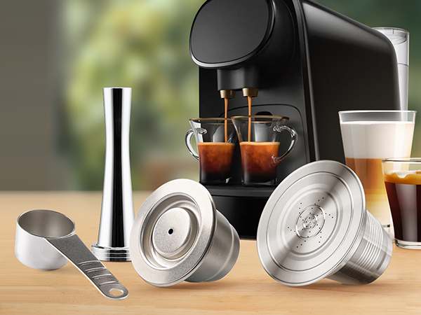 A rustic wooden table with a steaming cup of coffee and a few scattered coffee beans, showcasing the