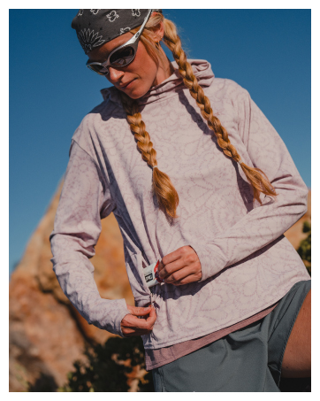 girl wearing sunglasses and Marmot airexchange hoodie out in sunny rocks