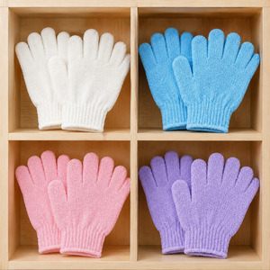 Four color-coded pairs of ATB exfoliating gloves organized by color