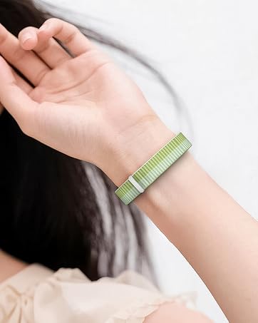 Series of images showing a slim green fitness tracking band worn on wrist, displayed from multiple angles to demonstrate its minimal design and wearability.