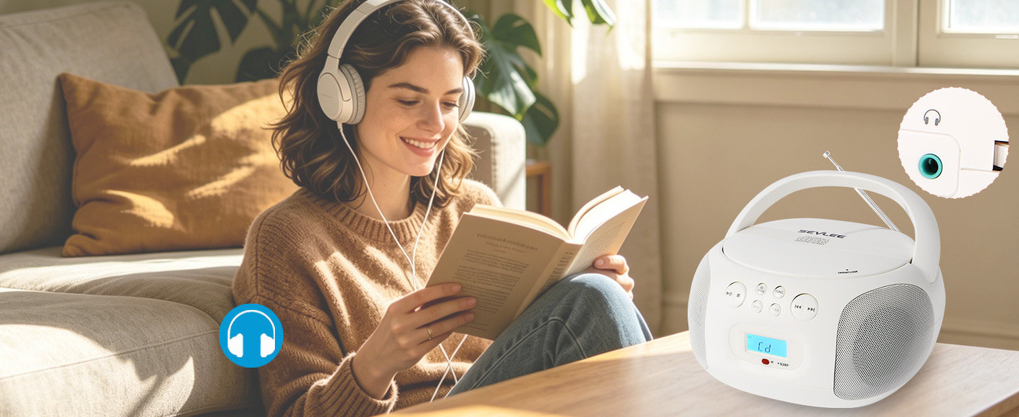 Girl with white headphones listening to CD player while reading on sofa.