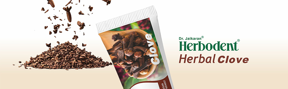 Scattered coffee beans with a product package labeled 'Herbodent Herbal Clove' visible in the corner.