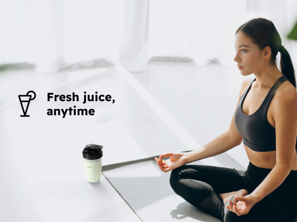 Woman exercises beside a portable Sangcon cup filled with a fresh green drink.