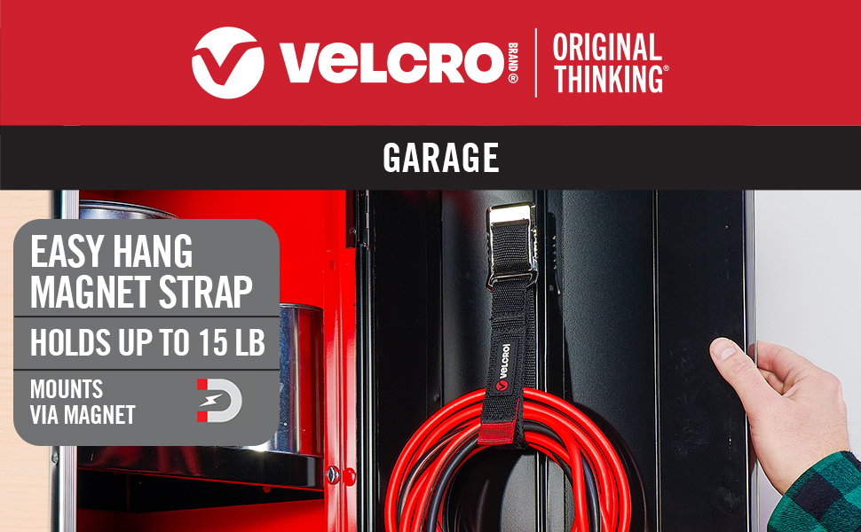 Magnetic straps securing extension cords and gear to metal shelving in workshop