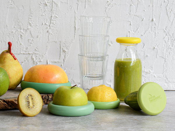 reusable silicone food savers from food huggers on fruits and vegetables