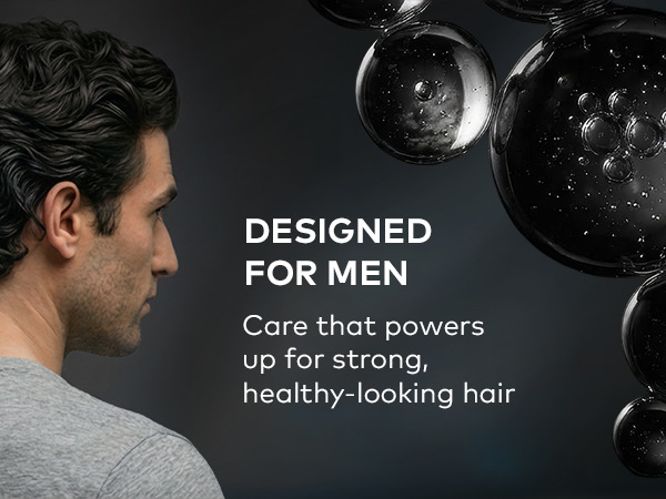 Text reads: Designed for men. A man with curly hair on a dark backdrop.