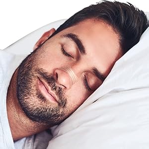 man sleeping with nasal strip