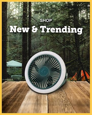 Camping nature background, with coghlans camp fan on a picnic table, text: Shop New and Trending