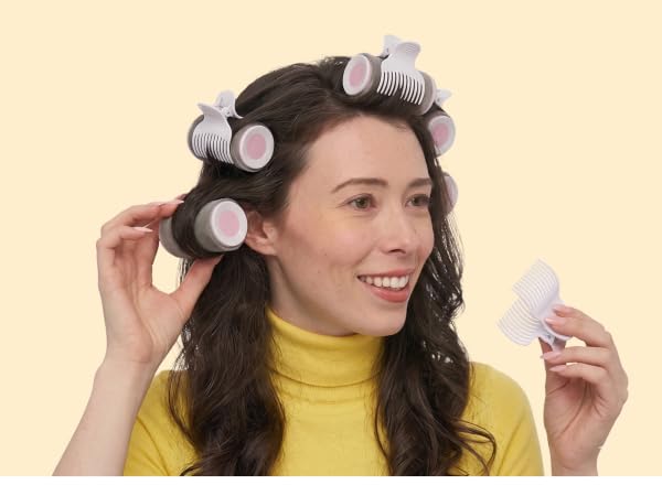 Woman using hot rollers