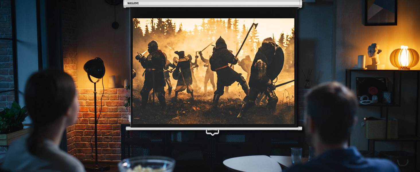 Wall-mounted projector screen displaying a silhouetted battle scene with medieval warriors. Two viewers watch from foreground in a dimly lit room with exposed brick walls.