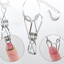 Demonstration of metal clip functionality showing close-up views of wire clips gripping mechanism and installation process.