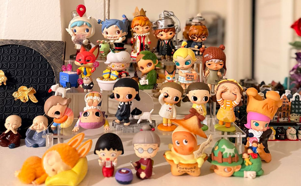 Collection of decorative miniature figurines arranged in rows, showing various colorful characters with different outfits and designs.