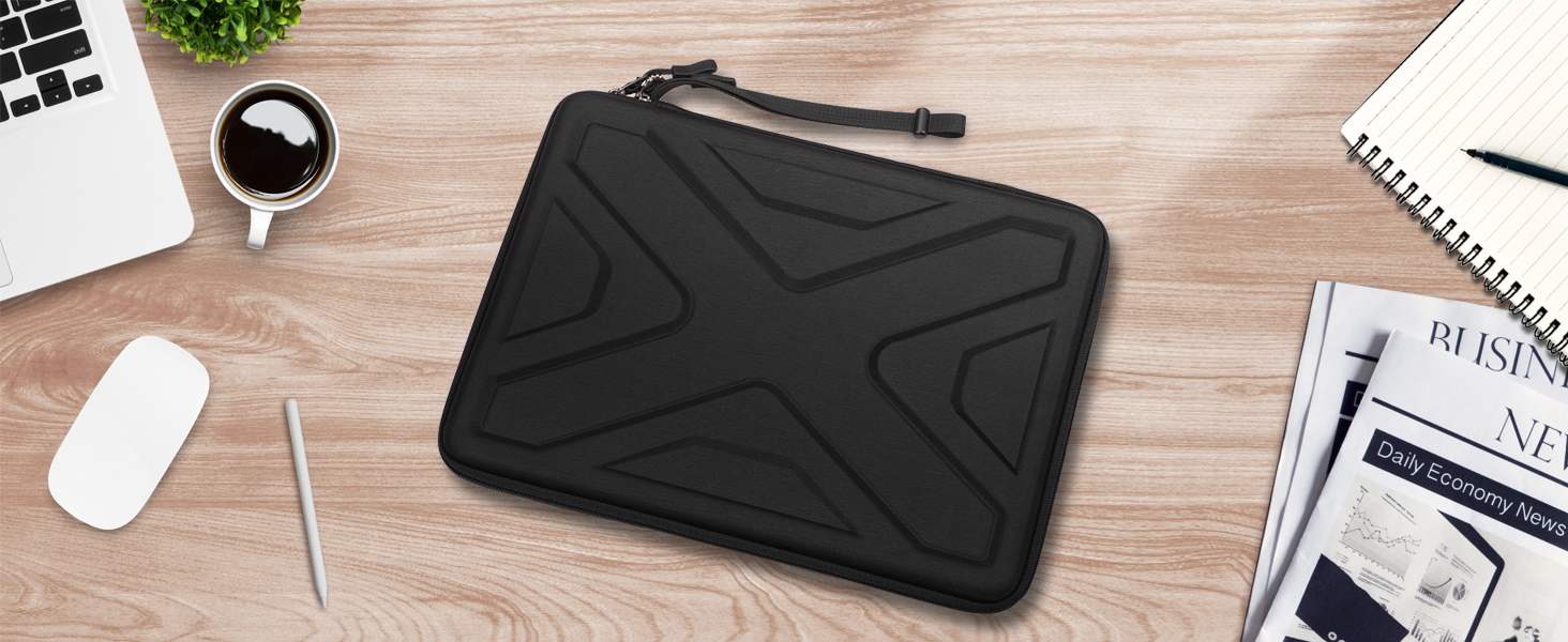 Black protective laptop sleeve case with geometric pattern design, shown on wooden desk with office accessories.