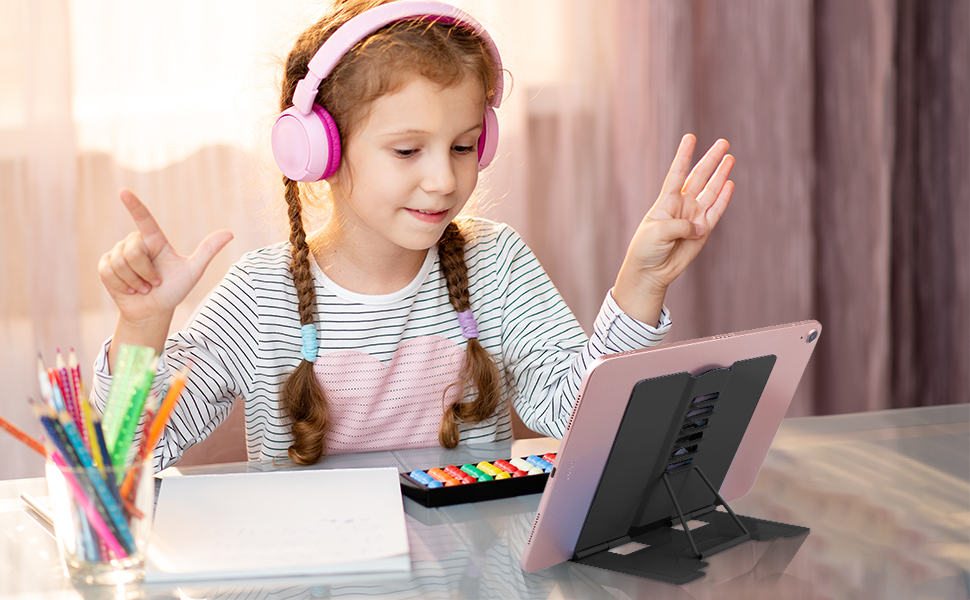 a girl with headphones and a tablet