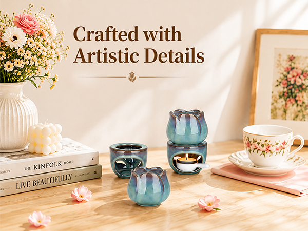 Text reads 'Crafted with Artistic Details.' Decorative home setting with blue ceramic vases, white flowers in vase, framed botanical print, candle, and 'FIND YOUR STYLE' book on wooden surface.