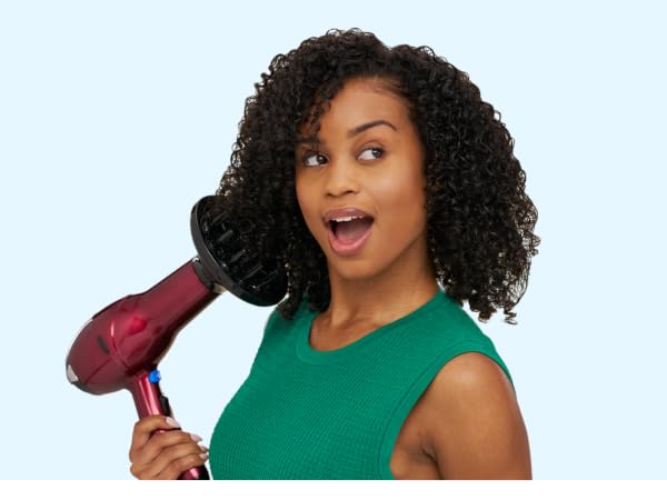 Woman using hair dryer with diffuser