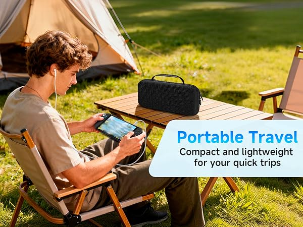 Text reads "Portable Travel" and "Compact and lightweight for traveling fun". Person sitting in camping chair using laptop outdoors near tent.
