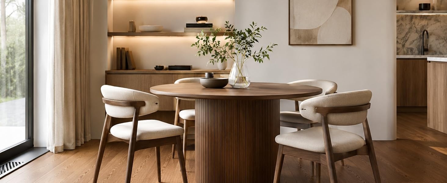 Elegant dining room featuring wooden floors and modern furniture