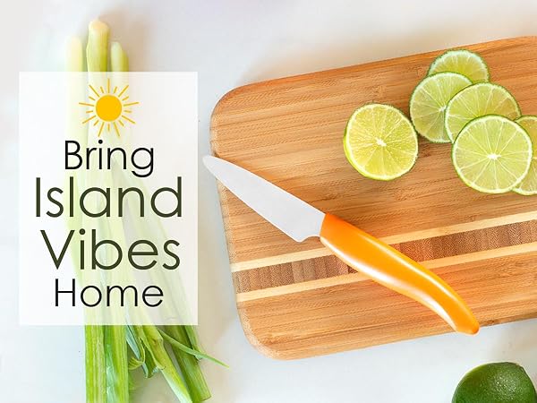 The Barbados Serving and Cutting Board being used to slice limes.