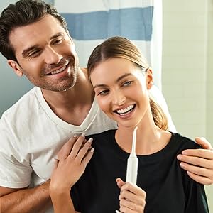 Man and woman using Aqua Flosser Pro