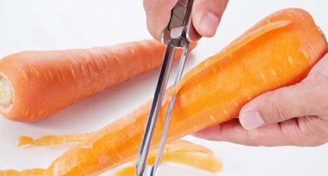 Peeling a carrot with a vegetable peeler