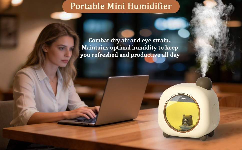 A woman works on a laptop beside a misting animal-shaped humidifier on a wooden table.