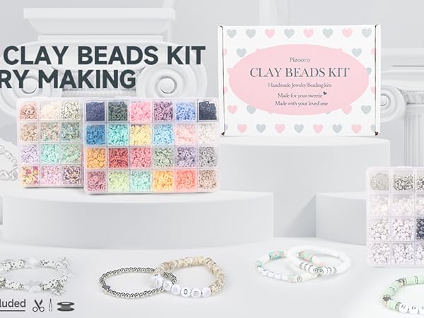 clay beads set in white sculptural buildings, some beautifully crafted jewellery.
