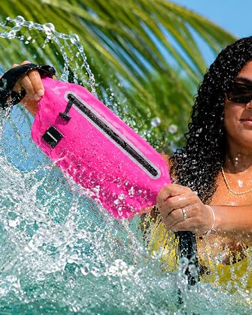 Girl splashing water on pink waterproof waistpack.