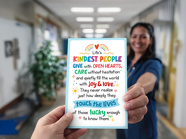 A photo of a hand giving social worker appreciation cards to a nurse.