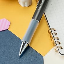 Photo shows Dr. Grip pen tip in a close-up desk shot