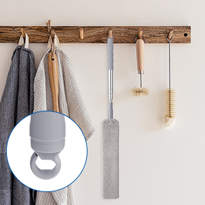 Wooden coat rack with hooks holding kitchen utensils. Inset shows gray silicone hook attachment with circular design for hanging items.